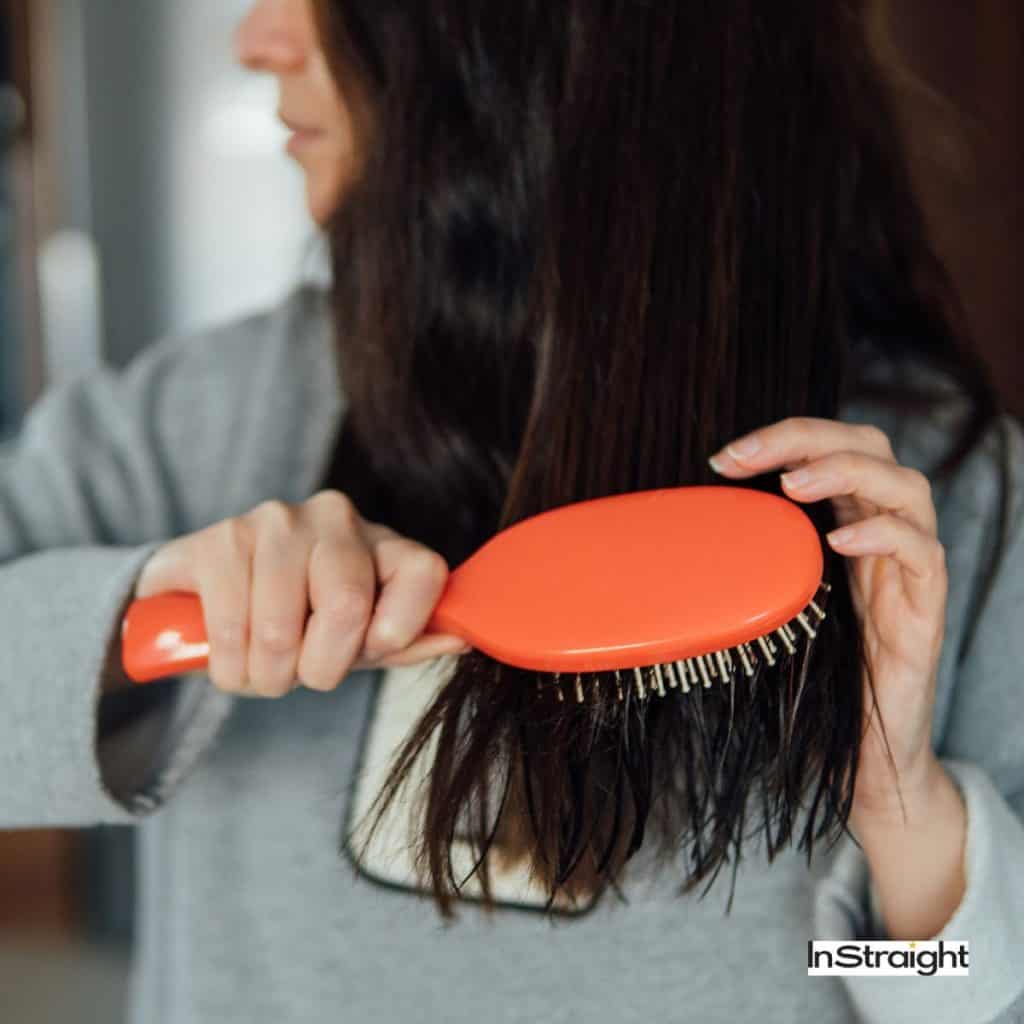 women brushing damaged hair but how long does it take for damaged hair to repair